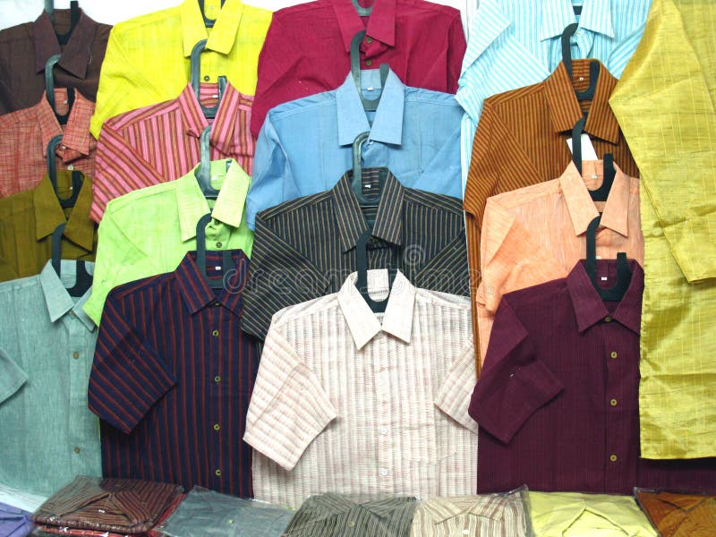 Man's wear: Some colorful cotton shirts on plastic hangers. Man's wear: Some colorful cotton shirts on plastic hangers.