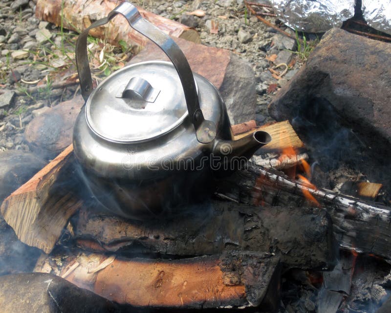 Camp fire with old kettle stock photo. Image of camper 36423050