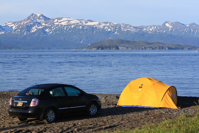 Many visitors to Homer, Alaska choose to camp, either in recreational vehicles, campers, or in this case car tent camping right on the beach in a specially designated area on the world famous Homer Spit, located at the end of Kenai Peninsula and surrounded by Kachemak Bay. A common summer cruise ship port of call, located on the very end of the Kenai Peninsula and part of the Pacific Ocean Ring of Fire, Homer is famous for commercial and recreational fishing, particularly halibut, outdoor recreation opportunities, and its eclectic artist vibe is popular with both Alaskans and tourists alike. Many visitors to Homer, Alaska choose to camp, either in recreational vehicles, campers, or in this case car tent camping right on the beach in a specially designated area on the world famous Homer Spit, located at the end of Kenai Peninsula and surrounded by Kachemak Bay. A common summer cruise ship port of call, located on the very end of the Kenai Peninsula and part of the Pacific Ocean Ring of Fire, Homer is famous for commercial and recreational fishing, particularly halibut, outdoor recreation opportunities, and its eclectic artist vibe is popular with both Alaskans and tourists alike.