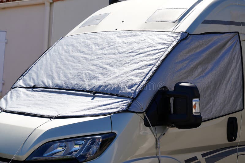 Camper with Windshield Cover for Night Light Protect Stock Photo