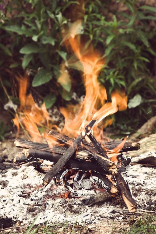 Camping bonfire close-up view with Instagram style filter