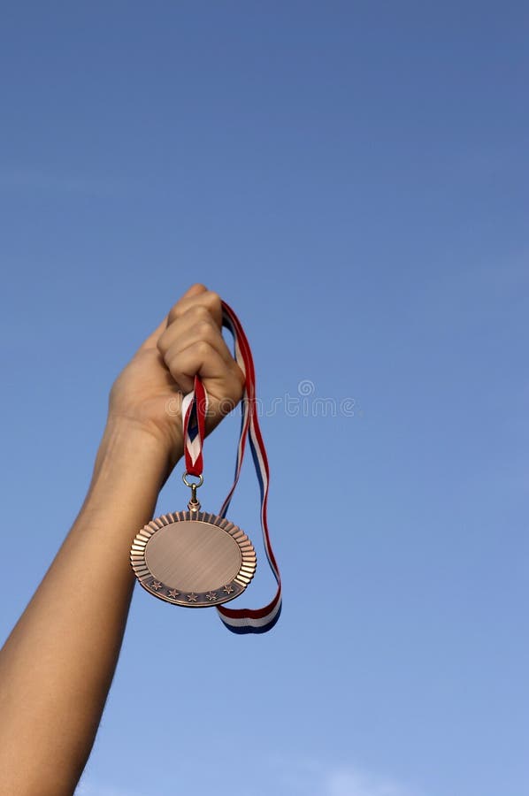 Arm holding award in sky. Arm holding award in sky