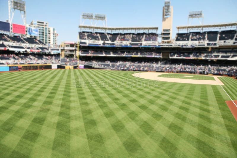 A baseball stadium with outdoor seating and field. A baseball stadium with outdoor seating and field