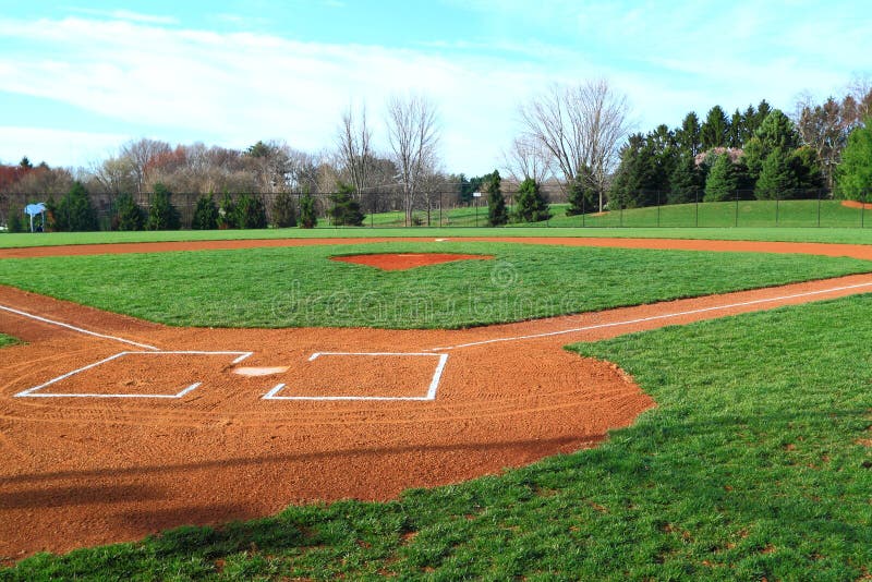 Empty Baseball Field with grass in Park at sunny day. Empty Baseball Field with grass in Park at sunny day.