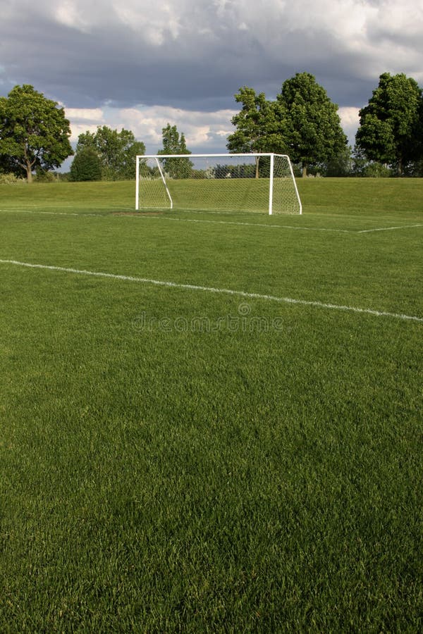 A view of a net on a vacant soccer pitch. A view of a net on a vacant soccer pitch.