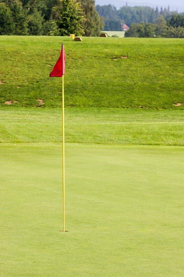 Green golf course with hole and flag. Green golf course with hole and flag