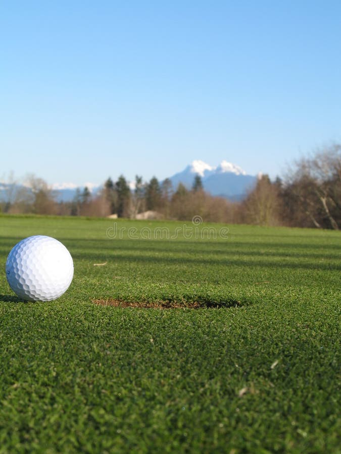 Early morning on the golf course with a mountain in the background. Early morning on the golf course with a mountain in the background.