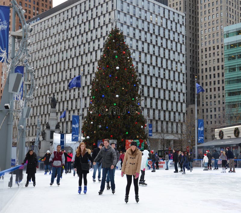 DETROIT, MI - DECEMBER 24: People skate in the rink at Campus Martius park in downtown Detroit, MI, on December 24, 2015. DETROIT, MI - DECEMBER 24: People skate in the rink at Campus Martius park in downtown Detroit, MI, on December 24, 2015.
