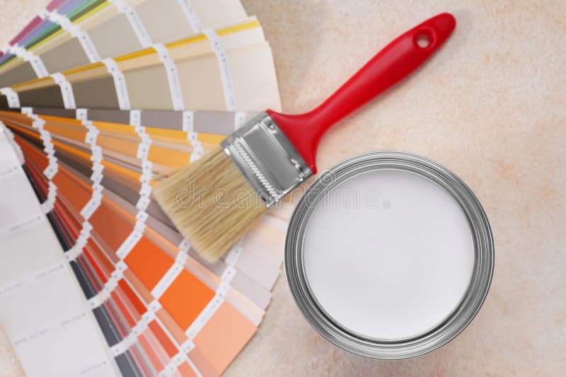 Can of White Paint, Brush and Palette on Beige Table, Flat Lay Stock