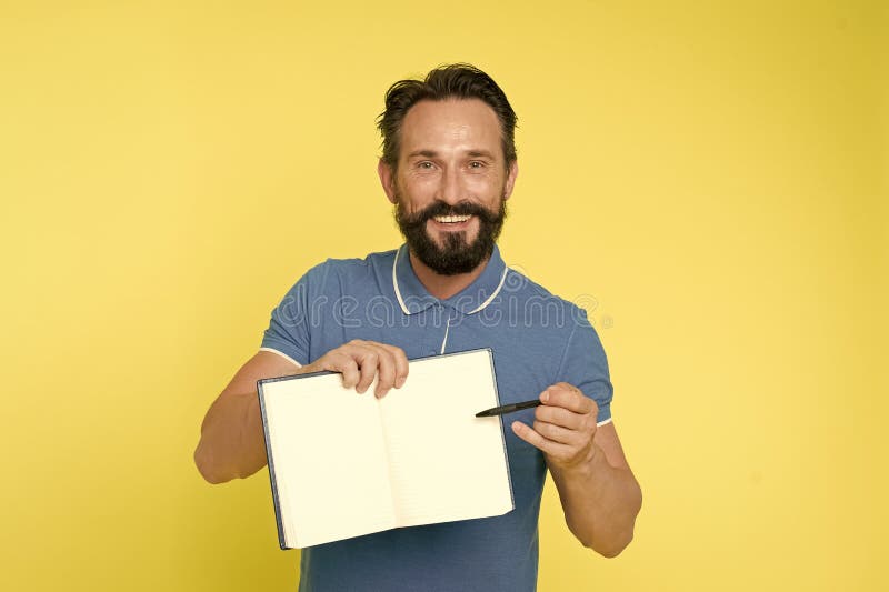 Can you sign here, please. Time management skills. Man planning schedule hold notepad. Man bearded manager happy smiling face. Successful man planning schedule meeting, copy space.