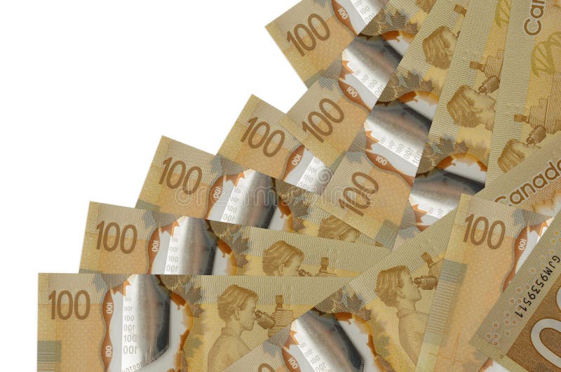 100 Canadian dollars bills lies in different order isolated on white. Local banking or money making concept