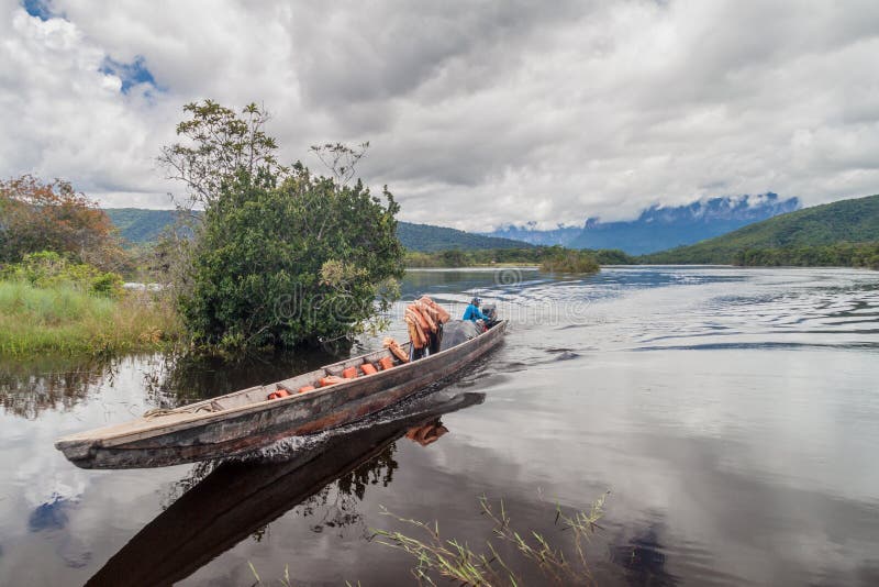 CANAIMA, VENEZUELA - AUGUST 16, 2015: Canoe on the river Carrao, Venezuela. It is used for tours to Angel Falls, the stock photos CANAIMA, VENEZUELA - AUGUST 16, 2015: Canoe on the river Carrao, Venezuela. It is used for tours to Angel Falls, the stock photos