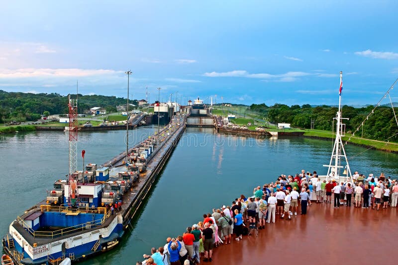 Tourists stand on bow of cruise ship as it enters first lock of Panama Canal on November 7, 2009 in Panama Canal. Tourists stand on bow of cruise ship as it enters first lock of Panama Canal on November 7, 2009 in Panama Canal.