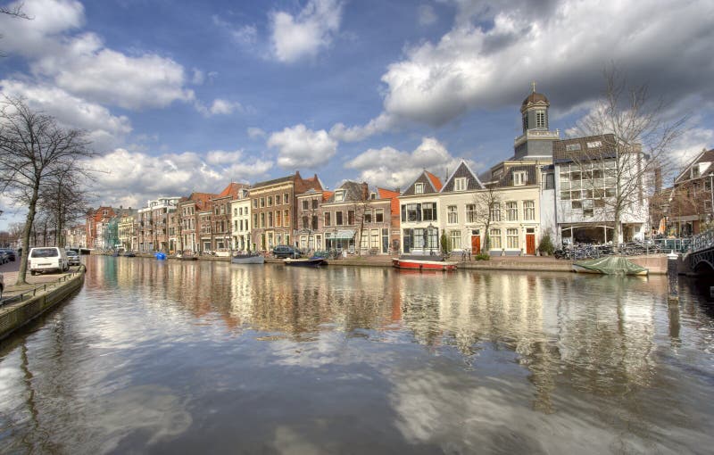 Canal in Leiden, Holland, with houses and church. Hdr bridge stock images, royalty-free photos and pictures