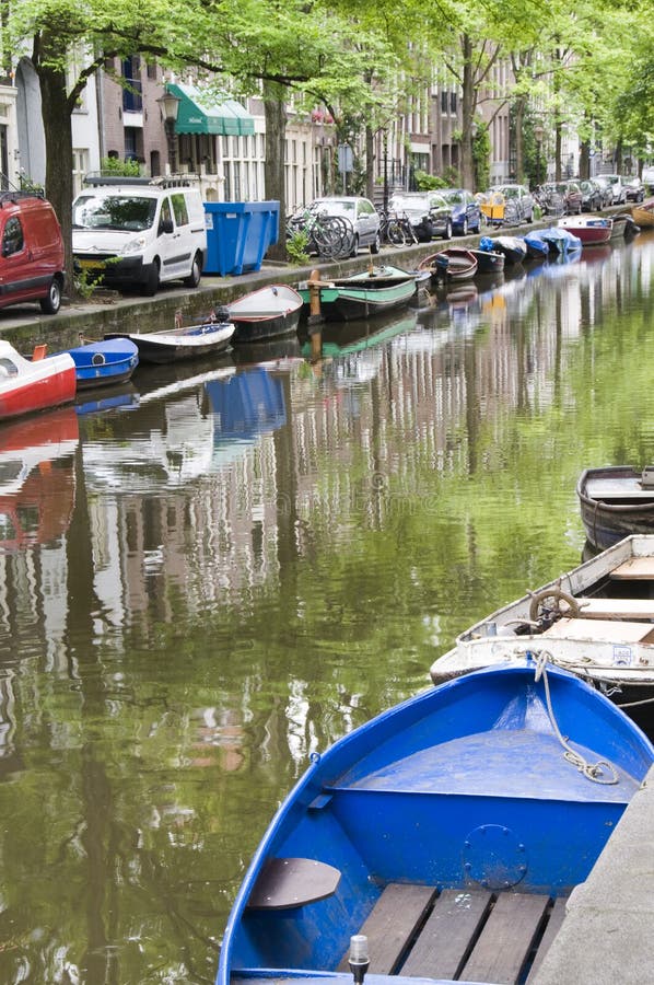 Canal scene with boats houses amsterdam holland