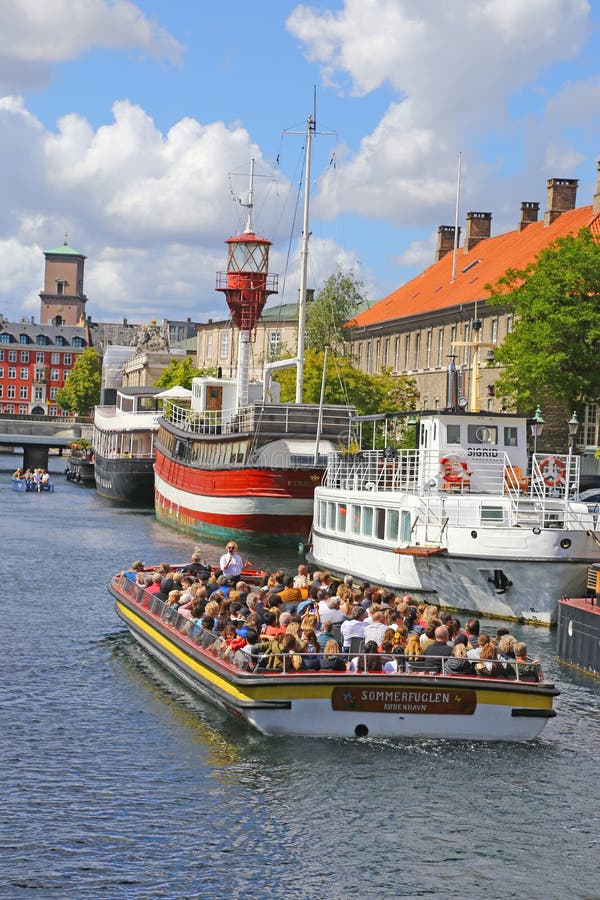 Canal tourboat on sightseeing trip on canal in Copenhagen, Denmark