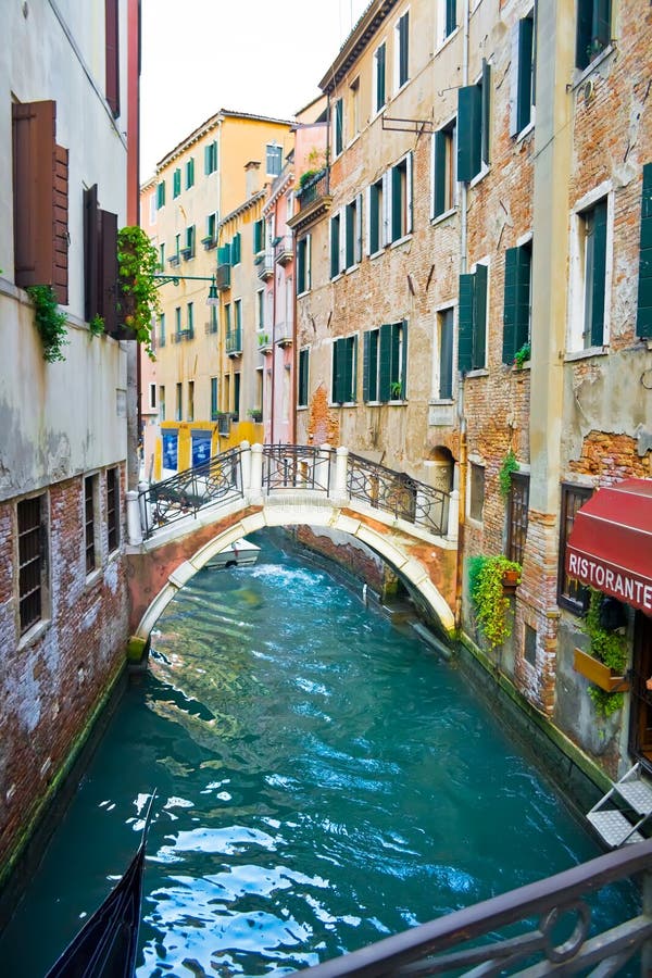 Canal in Venice and Restaurant