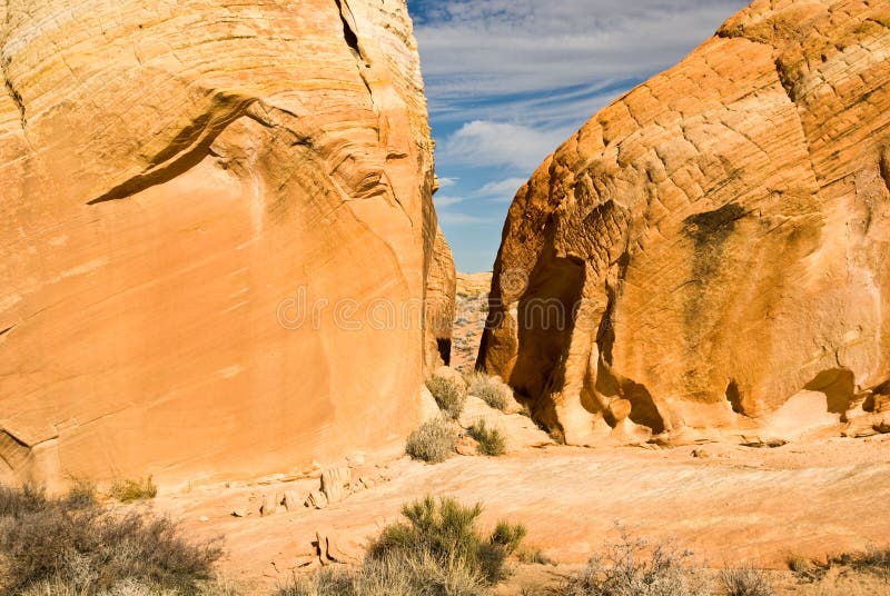 Hidden passageway between large, vivid sandstone rock formations in the Nevada desert. Hidden passageway between large, vivid sandstone rock formations in the Nevada desert