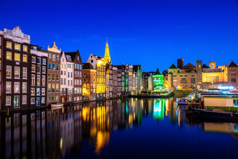 Canals and tradition house in Amsterdam at night. Amsterdam is the capital and most populous city of the Netherlands