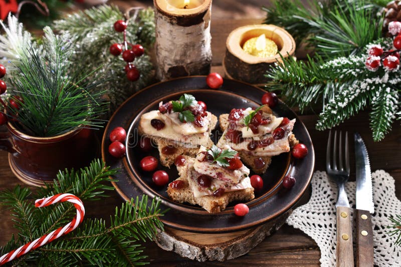 Star shaped canapes with herrings in oil and dried cranberries for Christmas. Star shaped canapes with herrings in oil and dried cranberries for Christmas