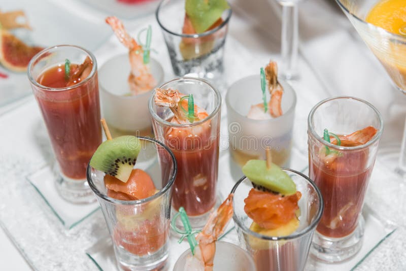 Canapes with fruit and shrimps in glasses royalty free stock image Canapes with fruit and shrimps in glasses royalty free stock image