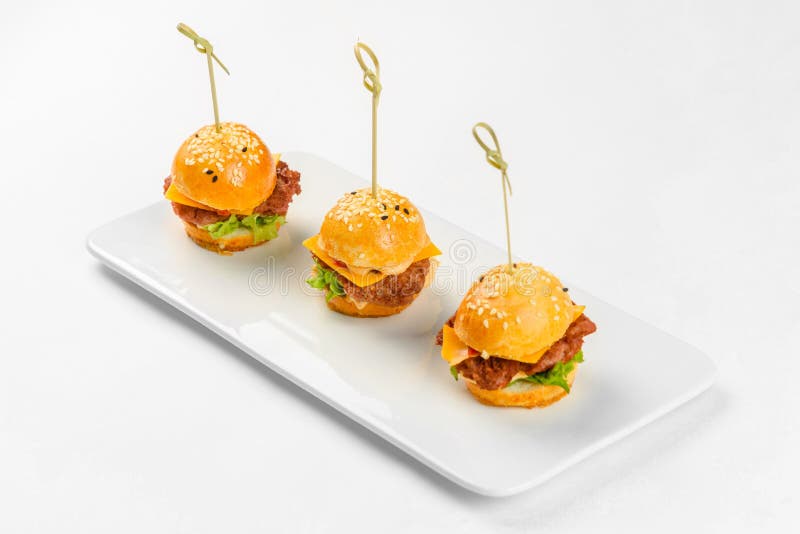 Canapes mini sandwich on glass dish on a white background. Catering service