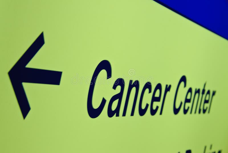 A sign pointing to a cancer treatment center. A sign pointing to a cancer treatment center.