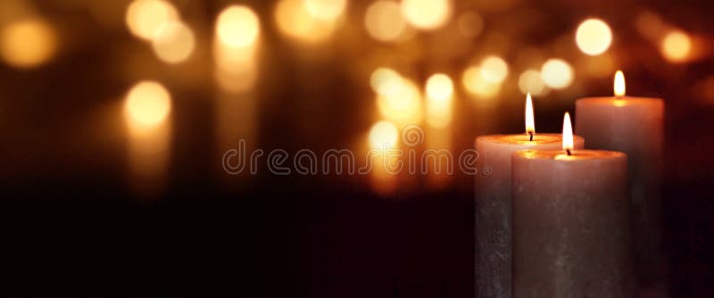 Dark background with burning candles and golden bokeh for christmas time. Dark background with burning candles and golden bokeh for christmas time