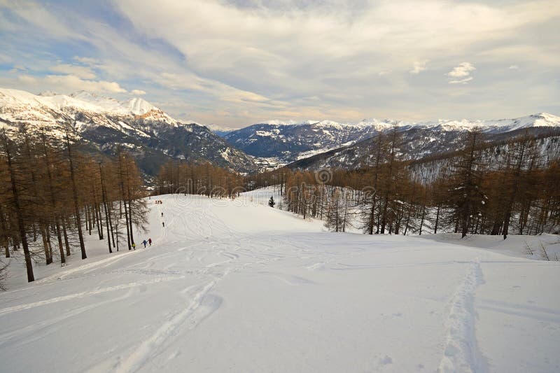 Candid ski tour slope in scenic valley