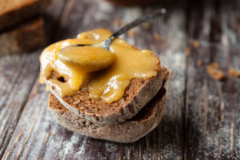 Candied golden honey on whole grain bread