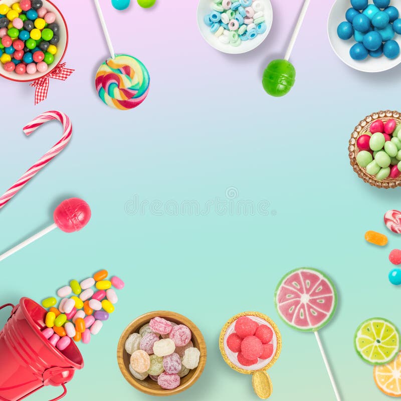 Candies, chocolates and lollipops on a soft rainbow background background with copy space. Backdrop, banner o background with