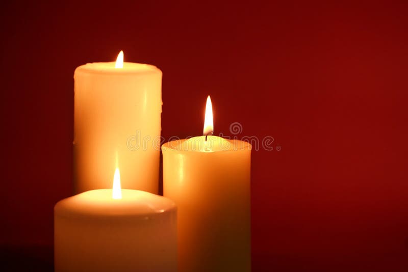 Lighted Candles on a Red Background Stock Photo - Image of candle ...