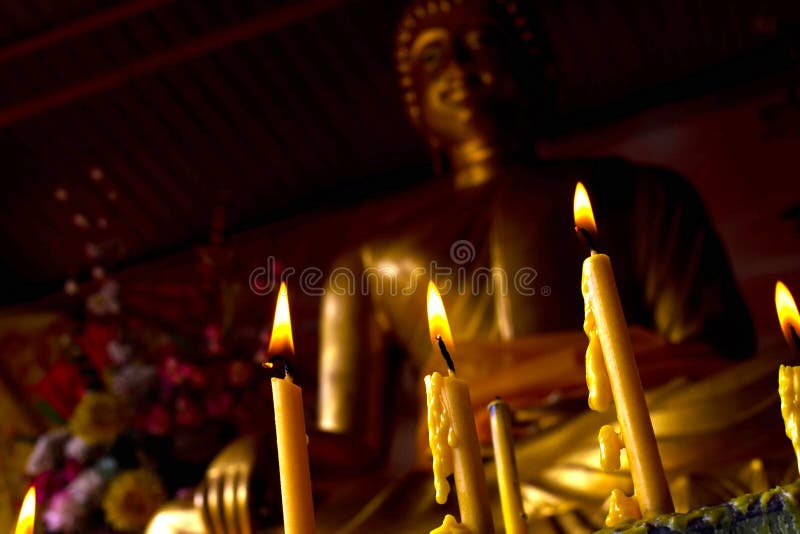 Candle with Buddha Statue stock image. Image of statue 32154145