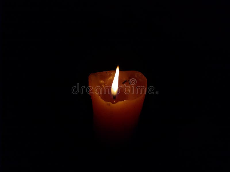 Candle Burning in the Dark, Yellow Flame Stock Photo Image of font