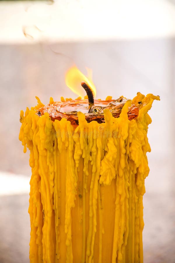 Candle with Fire Burn in Temple Isolated. Stock Photo Image of