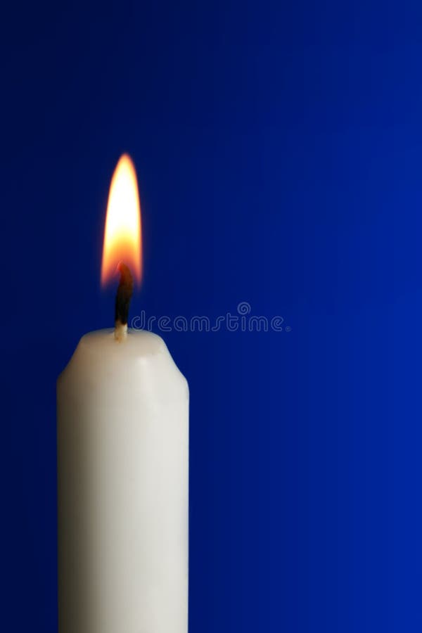 Burning Candle Flame CloseUp on Blue Background Stock Photo Image of