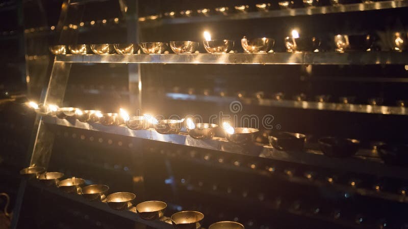Candle flame close-up. Many Candles in a Buddhist temple. Religious Festival. Oil Lamp royalty free stock photos Candle flame close-up. Many Candles in a Buddhist temple. Religious Festival. Oil Lamp royalty free stock photos