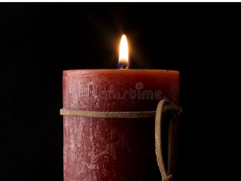 Candle Flame with Leather Strap. royalty free stock photography