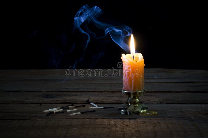 Candle, flame, smoke, burnt matches.