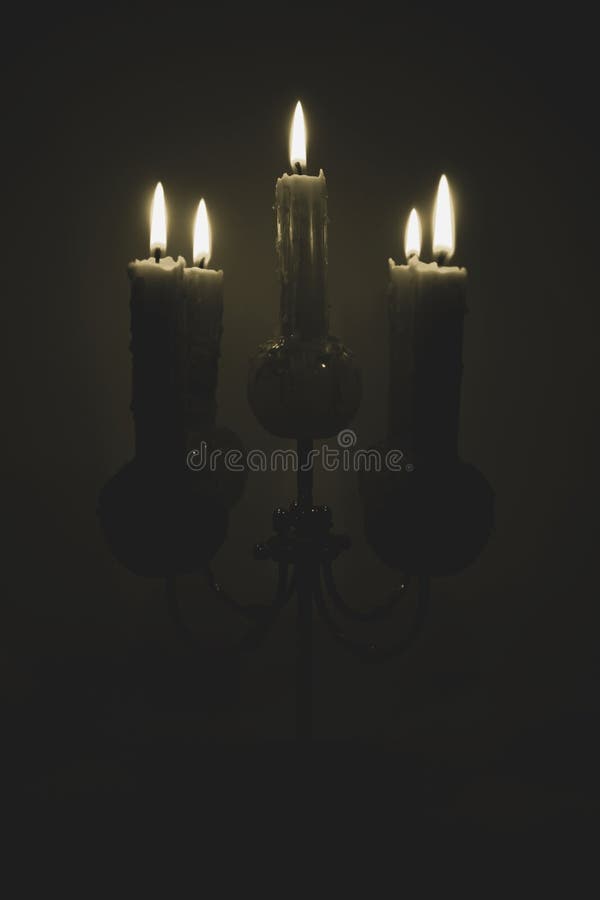 Candle Holder with Lit Candles in a Dark Room Stock Image - Image of ...