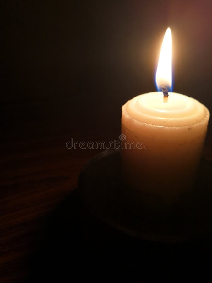Candle Light in the Dark. Various Brightness from Fire. No Wind. Copy