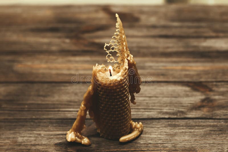 A Candle Made of Natural Wax is Half Burnt. Stock Photo Image of candlelight, yellow 274752738