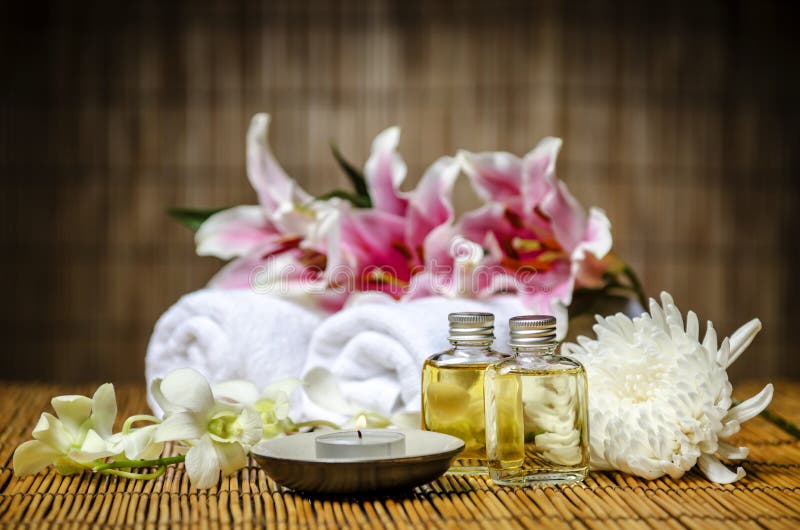 Candle and massage oil stock photo. Image of flower, lily 30898400
