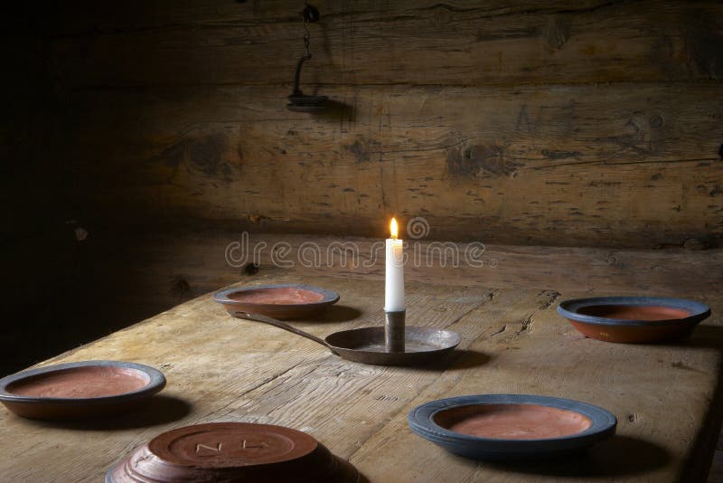 Candle and plates on the table