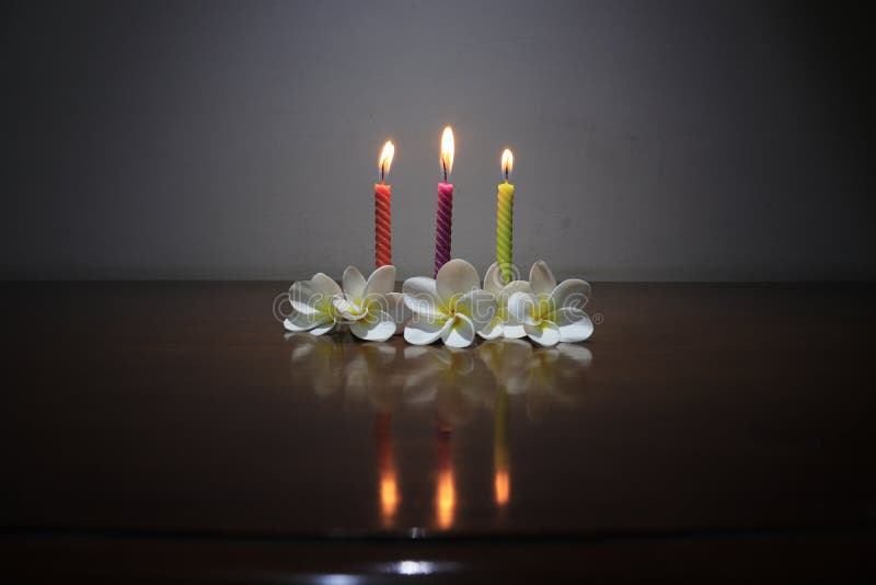 Rainbow Melting Wax Candle on Black Background