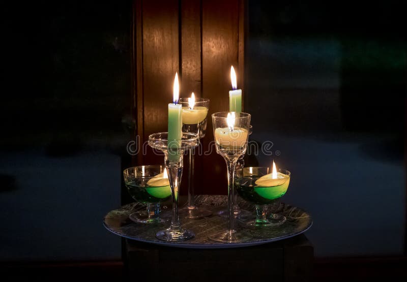 Candles Burning in Front of Glazed Doors in Market Harborough, UK Stock