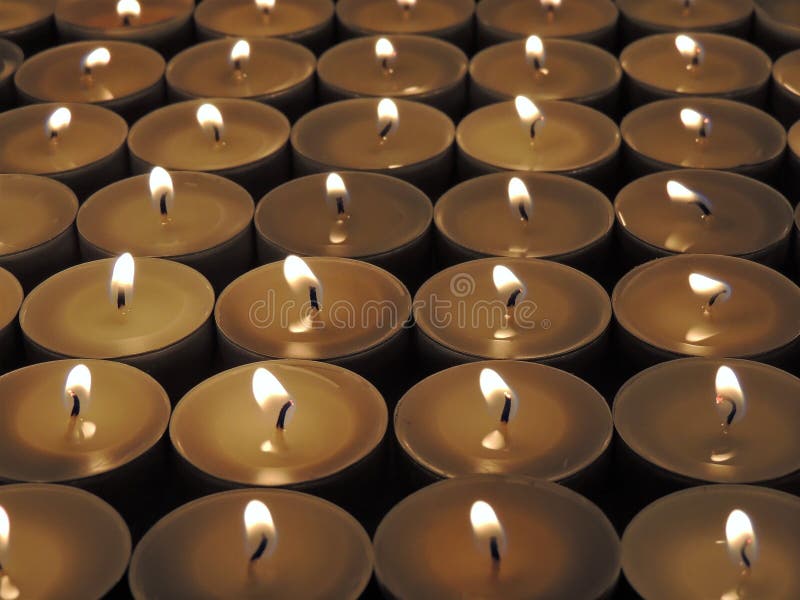 Candles burning at night stock image. Image of differently 135418557