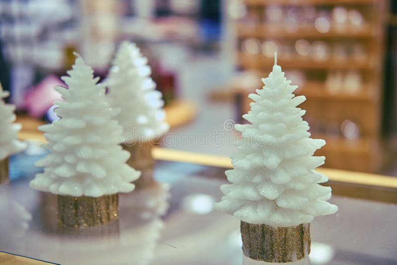 Candles in the Form of Christmas Trees on the Shop Window Stock Photo
