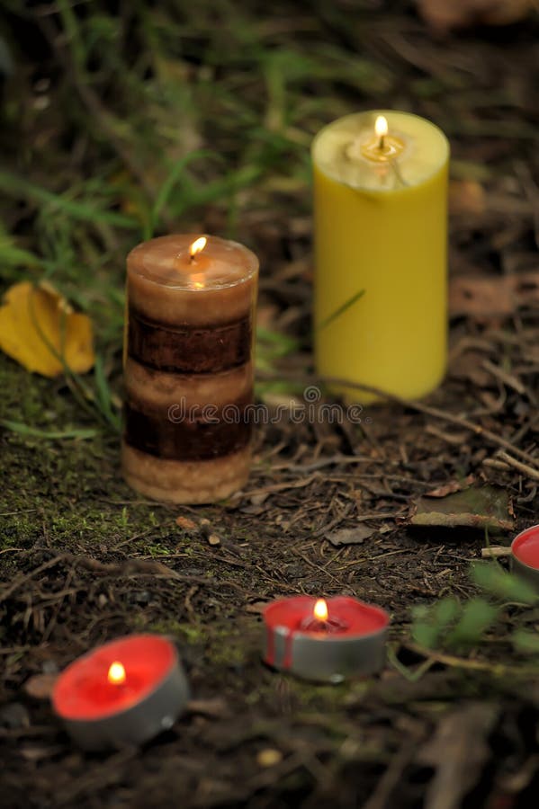 Candles on the ground stock photo. Image of holiday, white 44342642