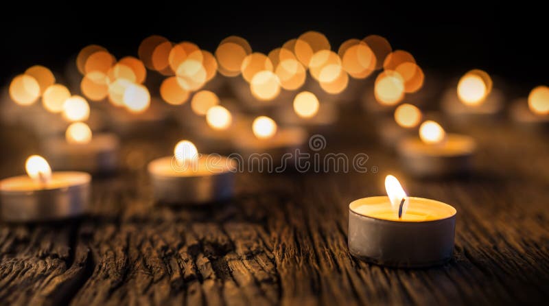 Candles light in advent. Christmas candles burning at night. Golden light of candle flame